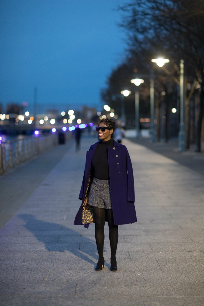 purple military coat black turtleneck bodysuit boucle shorts black tights chanel slingbacks nyc winter fashion 2016